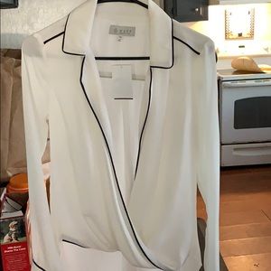 Cream colored open front blouse